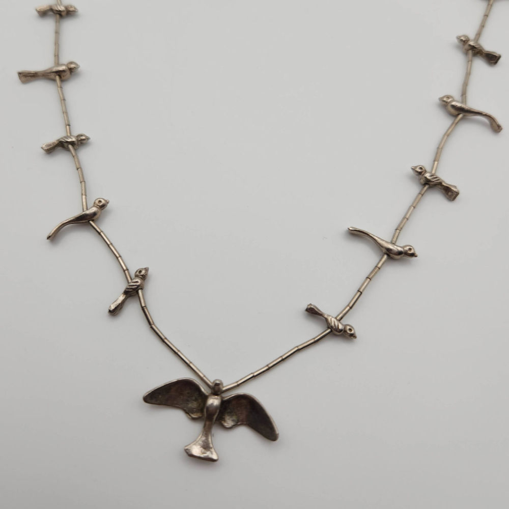 Lot 248: Sterling Fetish Bird Necklace Liquid Silver 17g
