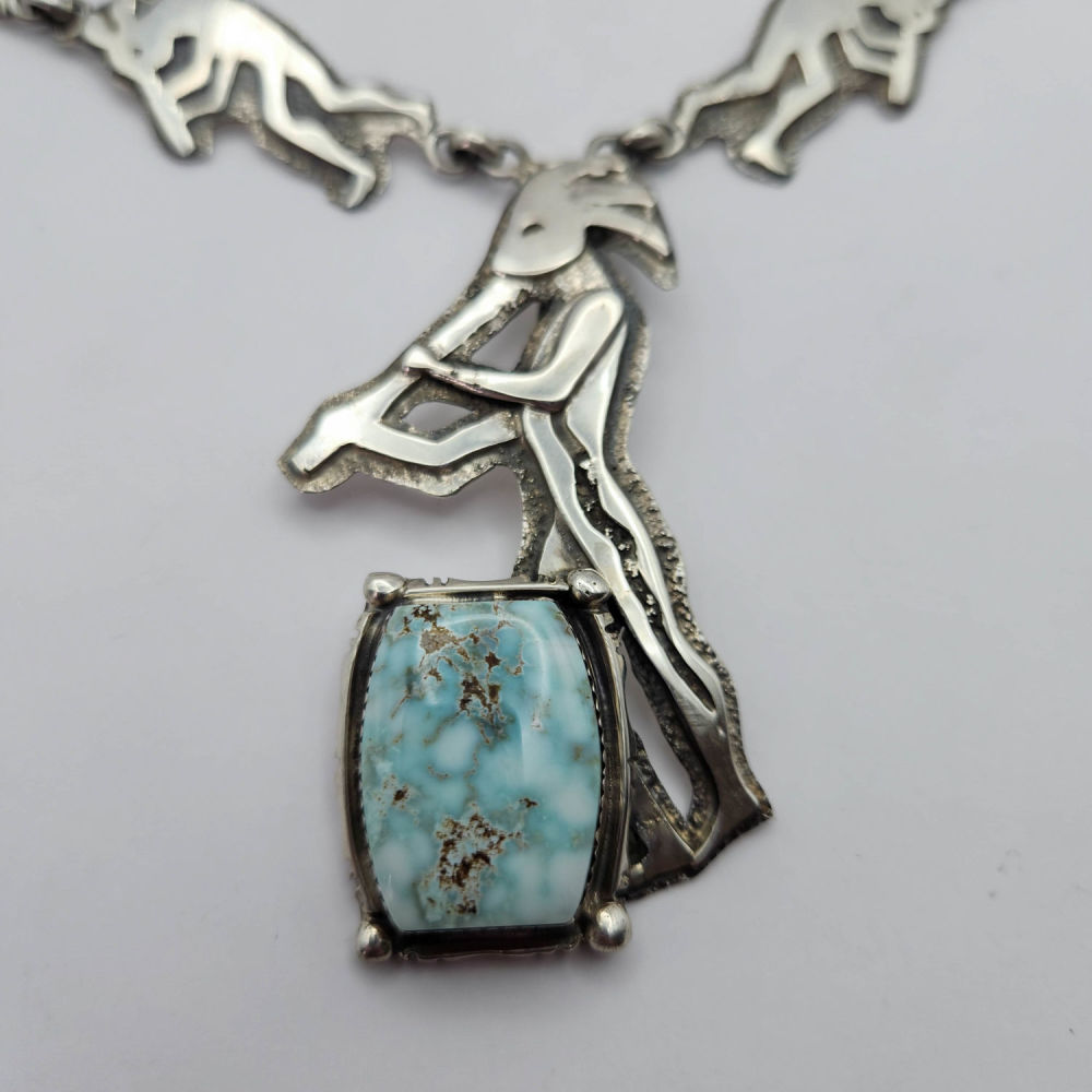 Lot 346: Dan Nieto Sterling Dry Creek Turquoise Flute Player 76G