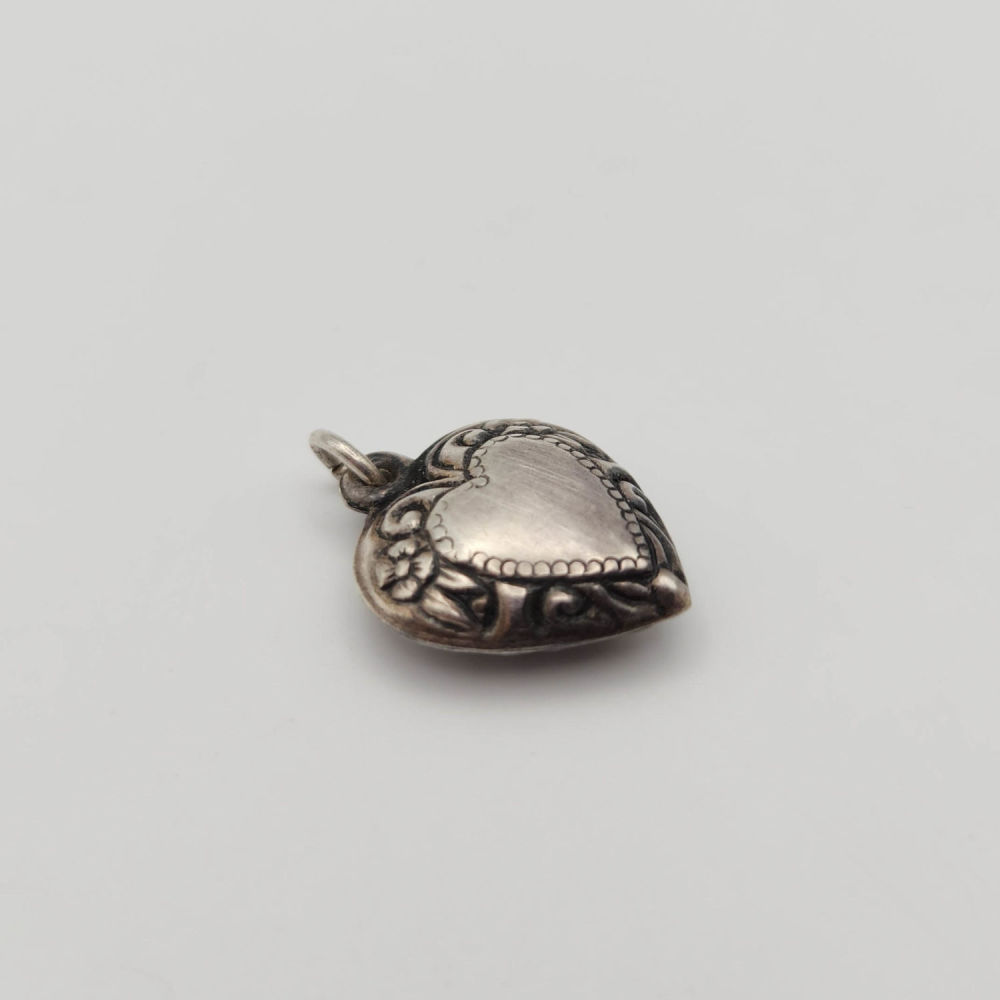 Lot 412: Antique Sterling Puffy Heart Charm 1.8g