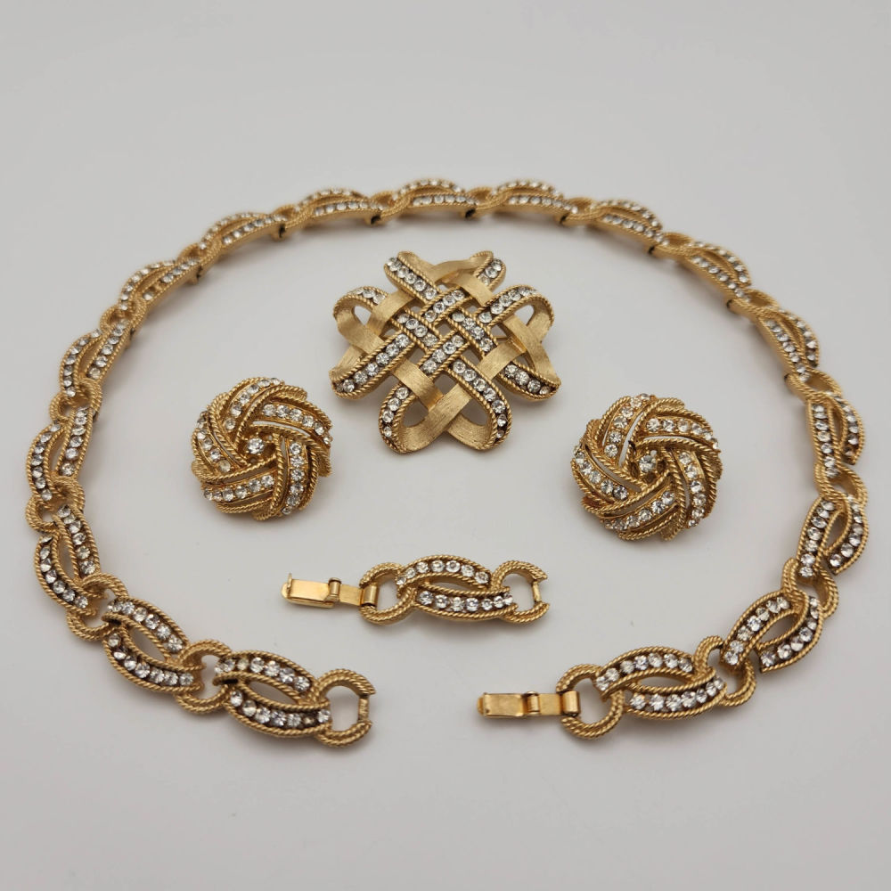 Lot 423: Crown Trifari Brushed Gold Rhinestone set Necklace/Earrings Brooch