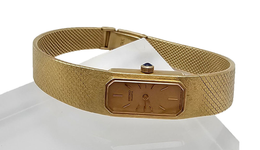 Lot 429: 14k Gold Seiko Quartz Sapphire Watch
