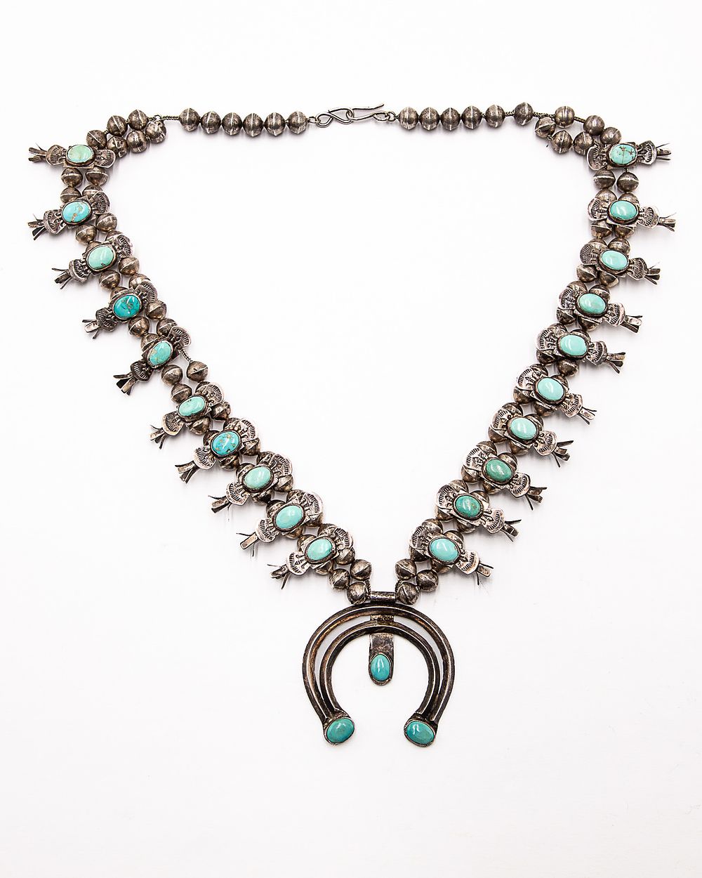 Lot 300: Vintage Navajo Hand Stamped Turquoise Squash Blossom Necklace