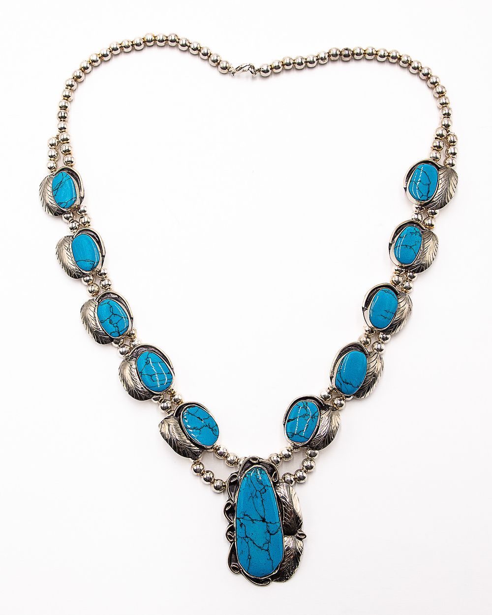 Lot 311: Mexico Sterling Howlite Squash blossom style necklace