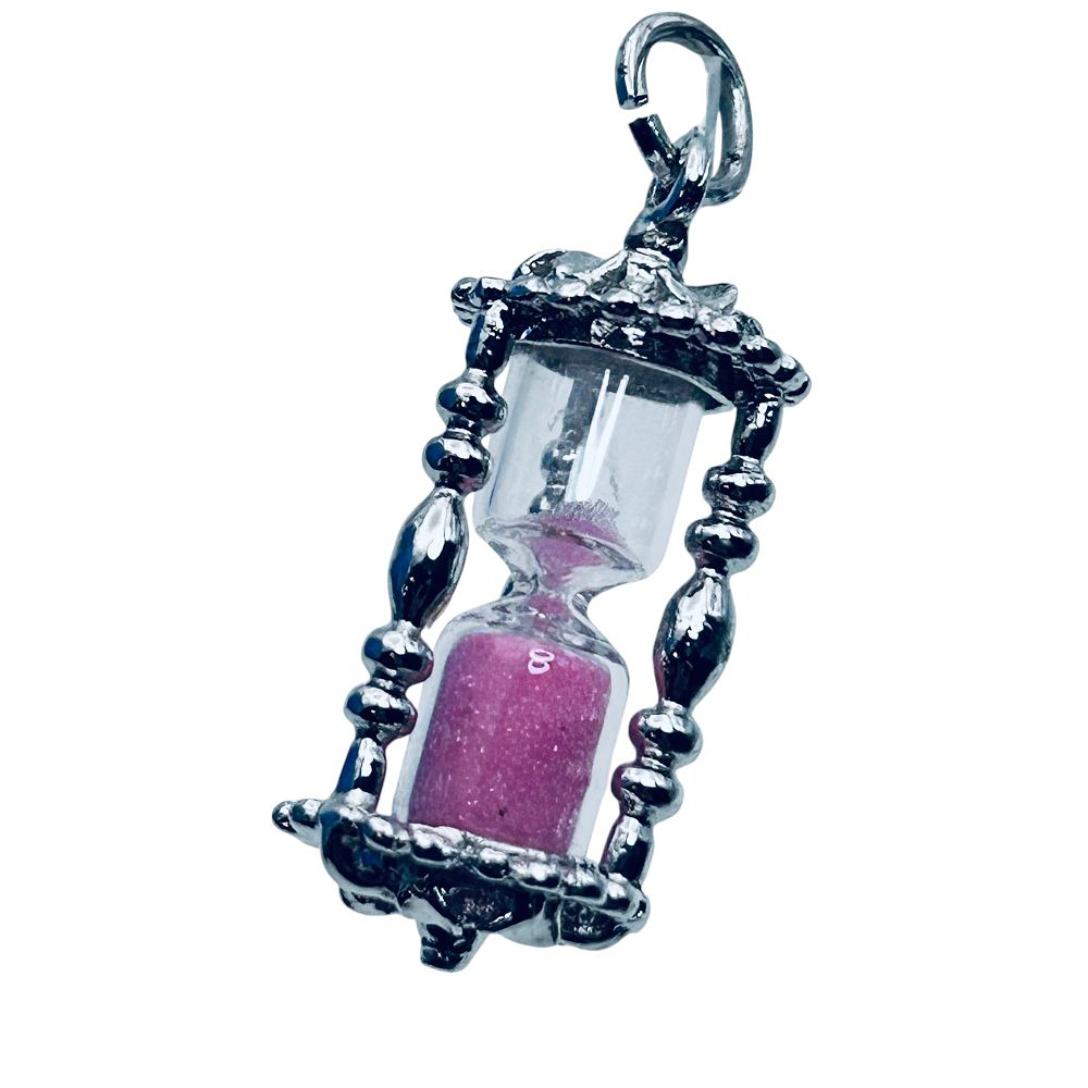 Lot 227: Spencer, Sterling Silver Pink Hourglass Pendant. 3.89g.