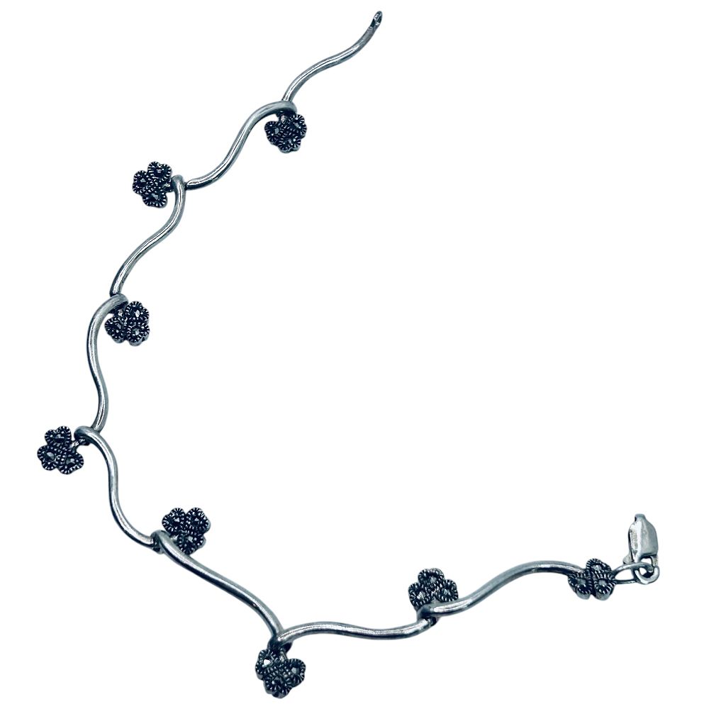 Lot 251: MARCASITE Sterling Silver Clover Twist Design Bracelet. 9.70 G. Unknown Mark.