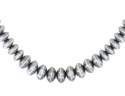 A Sterling Silver Graduated Navajo Pearl Saucer Bead Necklace. A sterling silver graduated 