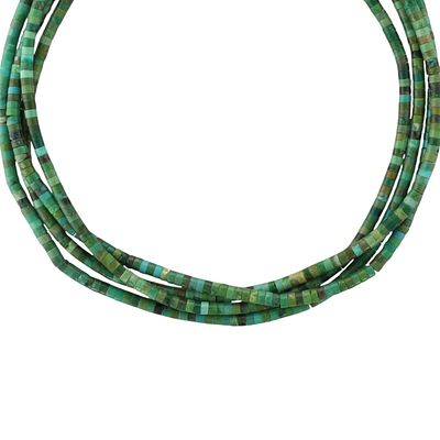 Navajo Sterling Kingman Turquoise Heishi Necklace. A Navajo necklace composed of numerous small 