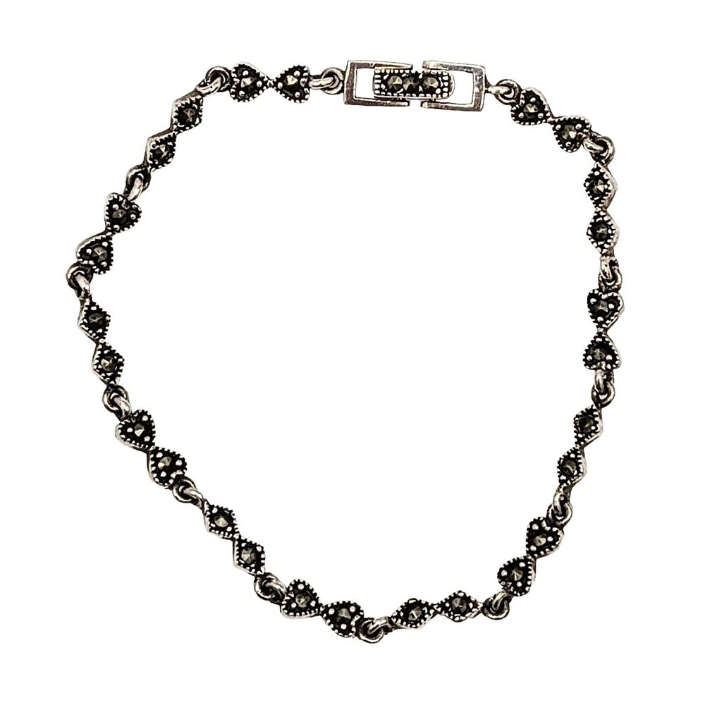 Lot 152: Signed Sterling Silver Marcasite Bow Detail Tennis Bracelet
