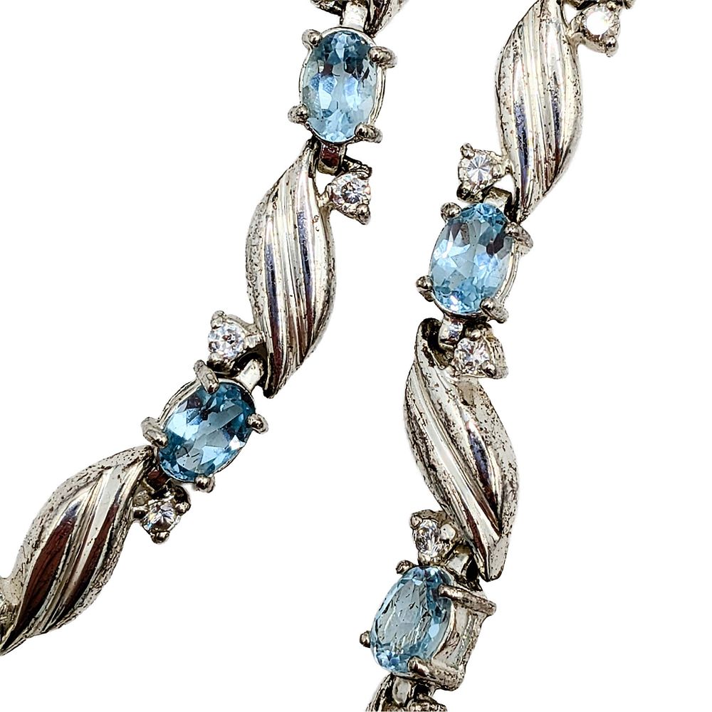 Lot 159: Signed Sterling Silver Topaz CZ Swirl Link Bracelet