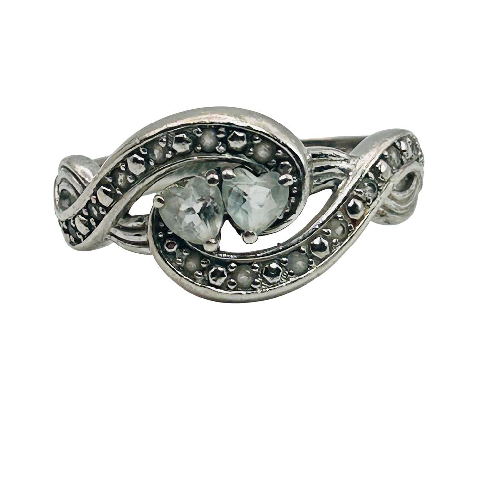 Lot 152: BGE Sterling Topaz Infinity Detail Ring. Size 10