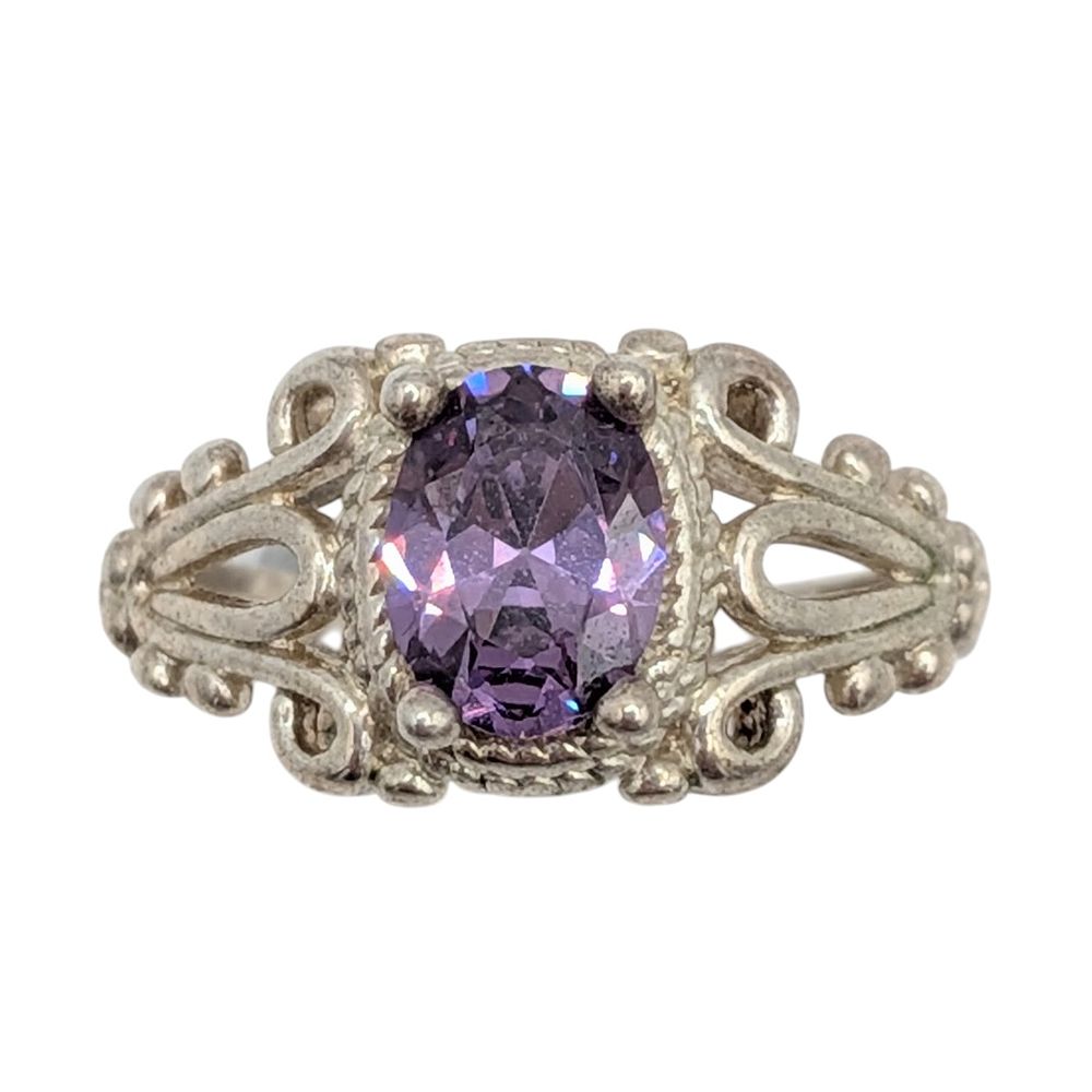 Lot 498: Sterling Silver Purple CZ Oval Scroll Ring