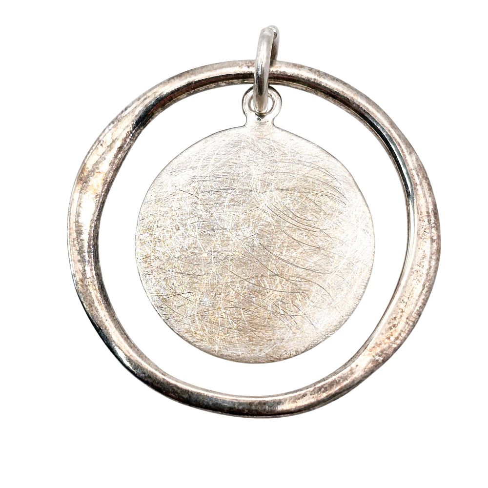 Lot 345: Sterling Texture Disc In Open Circle Pendant