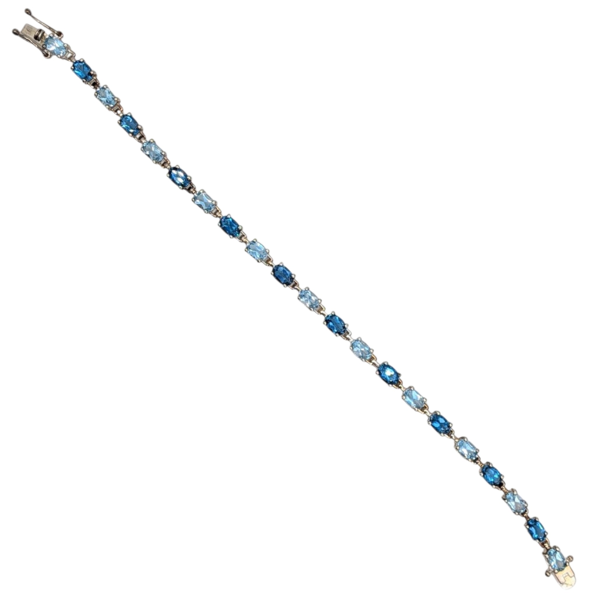 Signed Sterling Silver Blue Topaz Two Tone Oval Cut Tennis Bracelet
