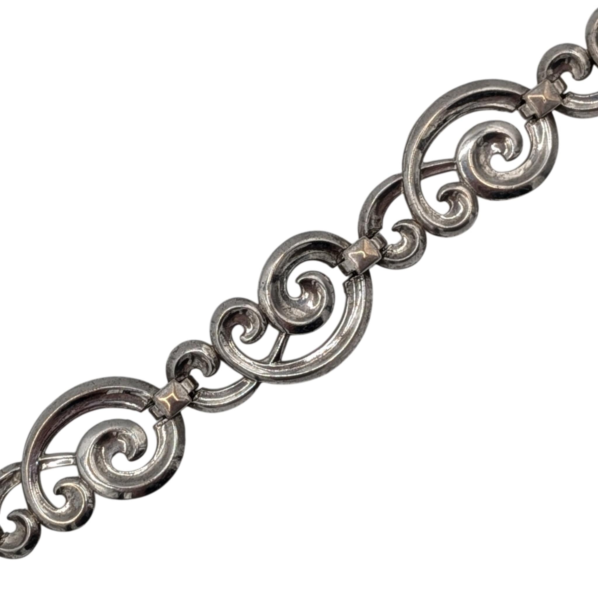 Signed Sterling Silver Scrolling Sectional Bracelet