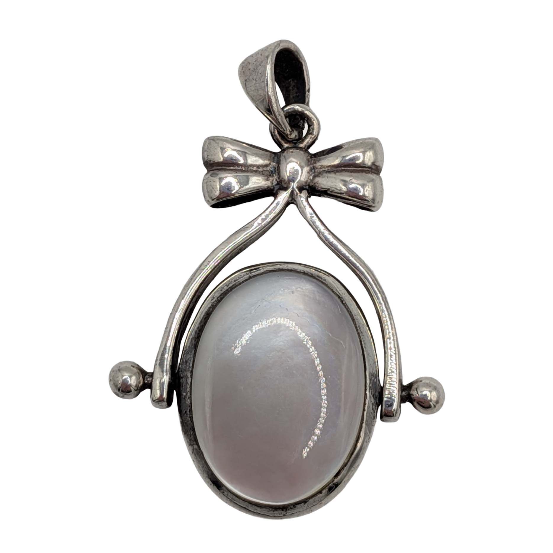 Sterling Silver Onyx Mother Of Pearl Bow Flip Pendant