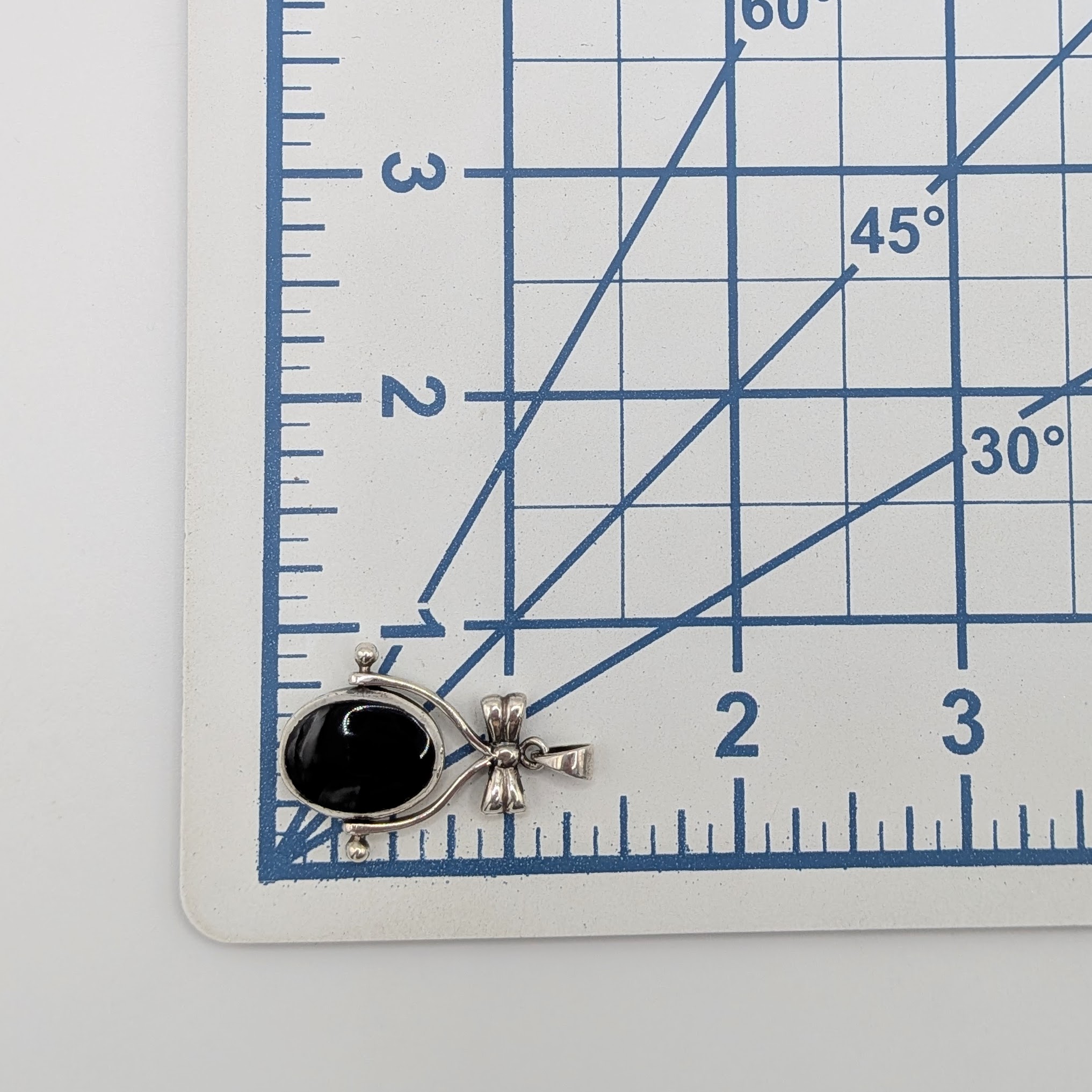 Sterling Silver Onyx Mother Of Pearl Bow Flip Pendant