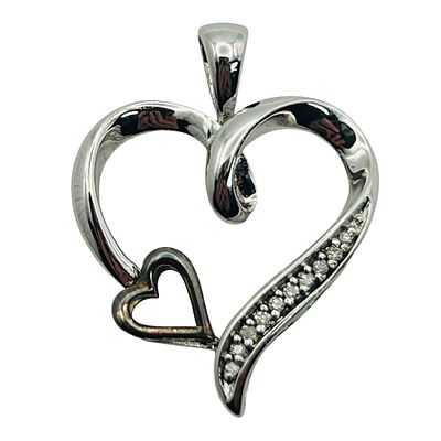 Sterling 10k Diamond Accent Heart Pendant. Sterling 10k diamond accent heart pendant. 1.4g