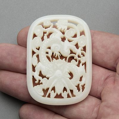 Chinese Kangxi Pierced White Jade Dragon Pendant. Chinese carved and pierced white jade plaque 