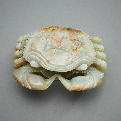 Chinese Carved Jade Crab Figure. Chinese carved jade figure in the form of a crab clutching a 