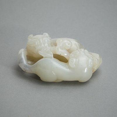 Chinese Late Qing Carved Jade Beasts. Chinese carved jade in the form of two intertwined 