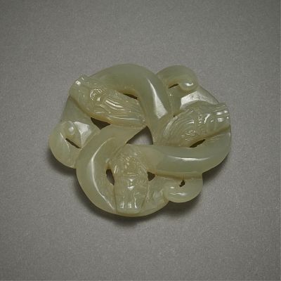 Chinese 20th c. Carved Trefoil Jade Beast. Chinese 20th century carved jade pendant in the form 