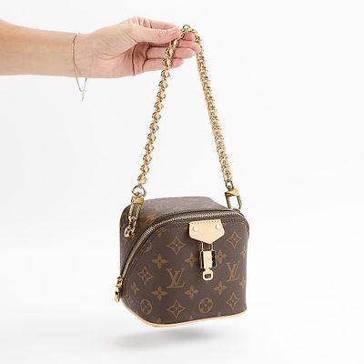 Louis Vuitton Just In Case, post 2021 new in box. Of cube form in brown monogram with leather 