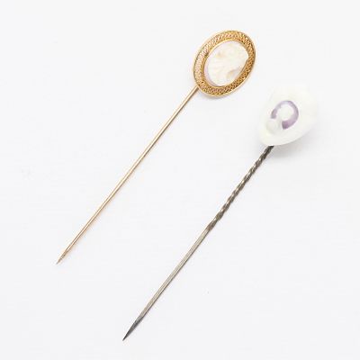 2 Cameo Stick Pins - Gold & Cowry Shell. Group of two cameo stick pins including one in 10k 