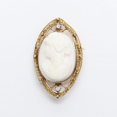 10k Shell Cameo Brooch with Diamonds. Pink conch cameo of a woman in profile set in a 10k yellow 
