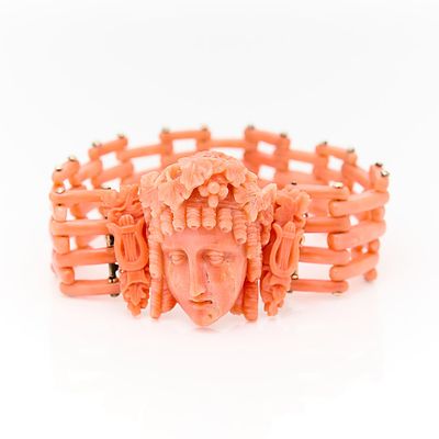 Italian 14k Gold Carved Coral Bracelet. Bracelet consisting of carved coral face with ringlets 