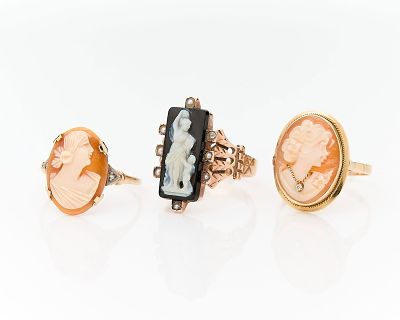 3 Gold & Shell Cameo Rings. Three cameo rings, including:One black rectangular cameo featuring a 