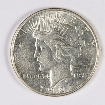 1922-D PEACE SILVER DOLLAR. BLAST WHITE. BU. SMALL BLACK SPORT ON REVERSE. ESTIMATE: $50-$75