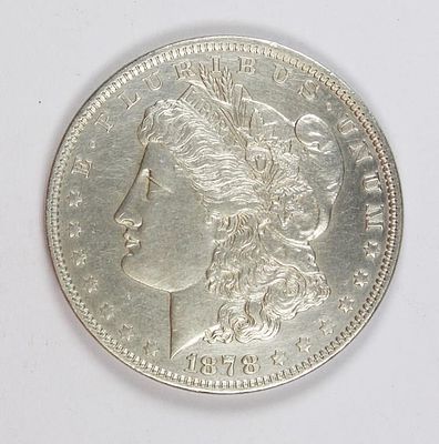1878 MORGAN SILVER DOLLAR. REVERSE 70. 7 TAIL FEATHERS. UNC. ESTIMATE: $150-$200