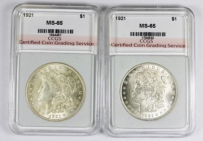 (2) 1921 MORGAN SILVER DOLLARS. CCGS MS 65. ESTIMATE: $200-$250