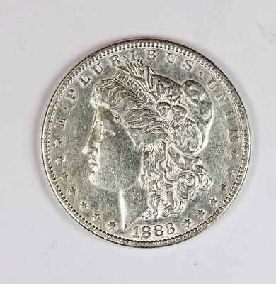 1883 MORGAN SILVER DOLLAR. AU. BLAST WHITE! ESTIMATE: $50-$75