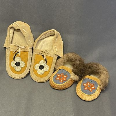 2 pair of beaded moccasins 1. 6 1/2" long, 2. 9" long. 2 pair of beaded moccasins Two pair of 