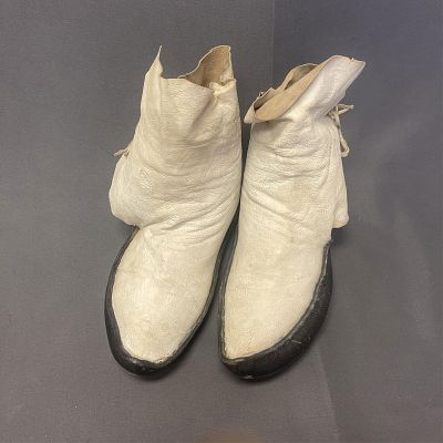 Pair of Pueblo style white leather moccasins Foot is 11" long x 5" wide. The boots are 8" tall. P 