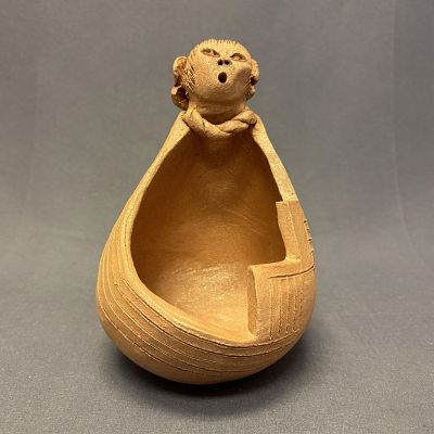 Authentic Taos Pueblo Micaceous Maiden Pot by Sharon Dry Flower Reyna Size: 7 1/2" high x 4 3/4". 