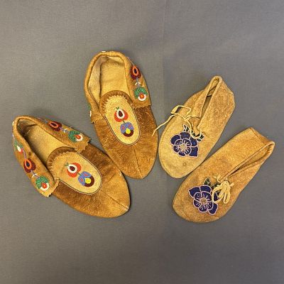 Group of 2 Beaded Moccasins Item 1: 10 1/2" long x 5 1/2" wide x 3" high, Item 2: 9" long x 4" wide