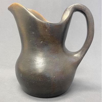 Faye and George Greiner Catawba pottery pitcher, 9" tall, 10" deep from spout to handle, 8" wide. 