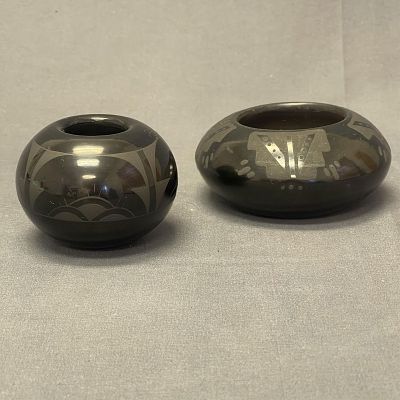 2 highly polished and painted Santa Clara black pots - signed, Mary Sisneros, and Annie Baca 1. 