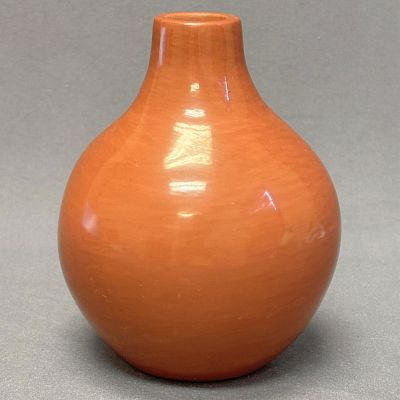 Irene Tse Pe, San Ildefonso Pueblo red polished vase 6" high x 4" wide x 1" diameter at mouth. Ir 