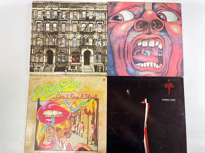 Assortment of 9 vinyl records A collection of nine vinyl records featuring iconic albums: Led 