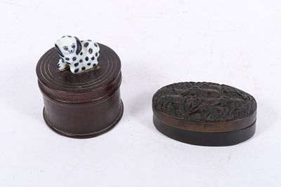 Two South East Asian trinket boxes: teak cylindrical box with porcelain Staffordshire dog and 