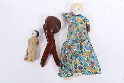 Antique German china head dolls and Black Forest figural nutcracker depicting Otto von Bismarck 