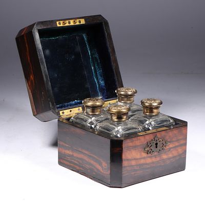 Victorian Coromandel wood and brass perfume casket box with mirrored lid and four glass perfume 