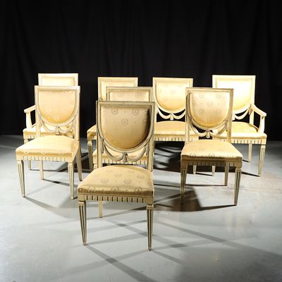 Eight French Empire carved swag dining chairs with damask upholstery. 39 1/2"H x 22 3/4"W (one 