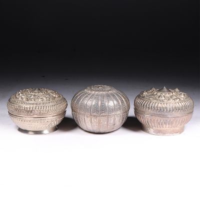 Three Southeast Asian / Thai silver repousse round betel boxes 2H x 2 1/2D (box on right). Thre 