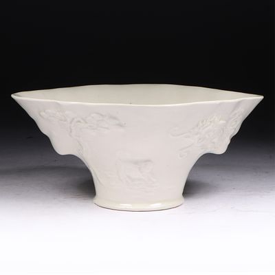 Chinese blanc de Chine porcelain libation cup with deer and Qilin dragon motif. 3H x 6W x 5D