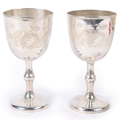 Pair Chinese Export sterling silver wine goblets with dragon motif in custom case with stands. 