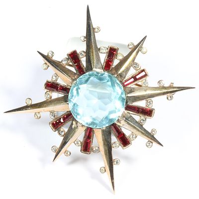 Crown Trifari 1944 sterling silver vermeil starburst brooch with large aqua jewel center and 